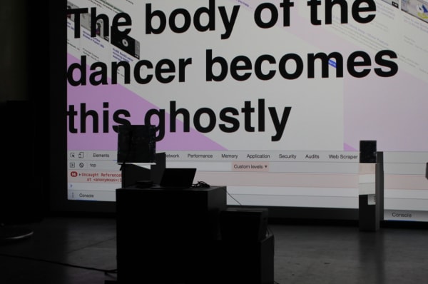 a partial view of a screen in darkness