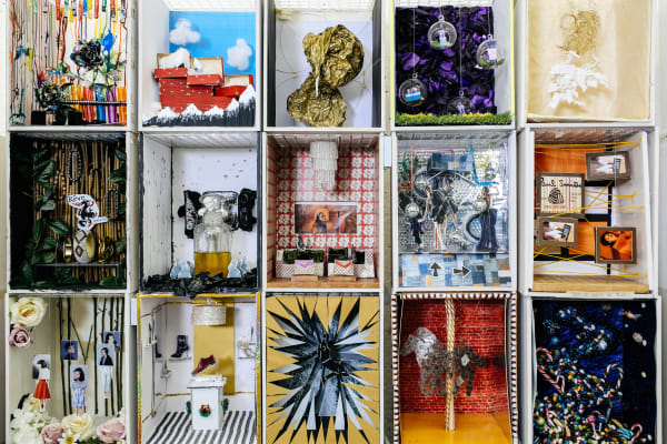 student work, collage structure containing 12 small square compartments, each one with a different theme and textures.