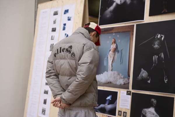 A person looking at a display of images 
