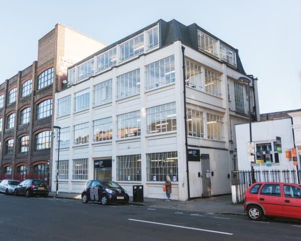 The outside of a square white building 