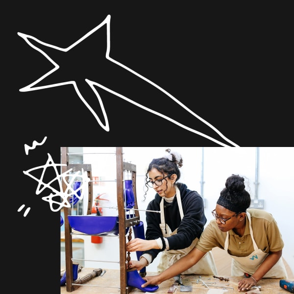 Two students building a chair