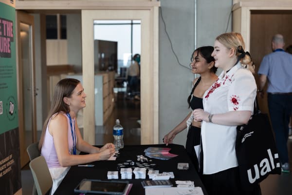 Students speaking to staff at the Careers Fair 2024 at East Bank. Photography by India Mae Alby.