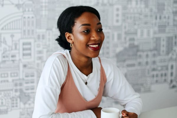 Chenai Nduru sitting at a desk