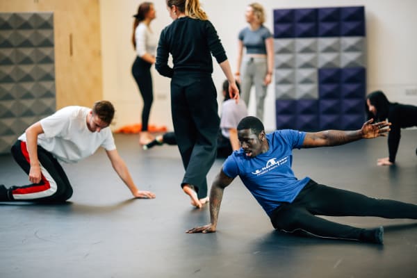 Students participating in a performance workshop in the training studio at Wimbledon.