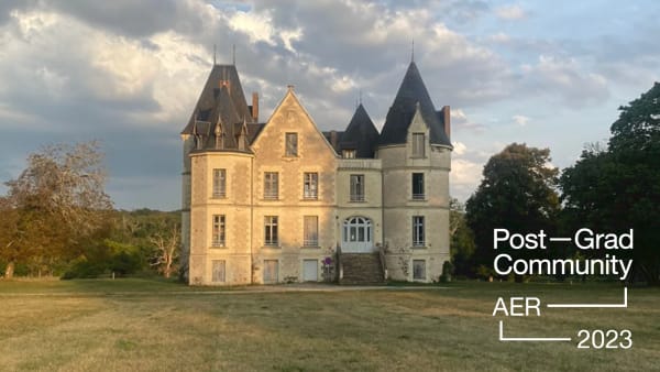 a photo of a mansion in a field