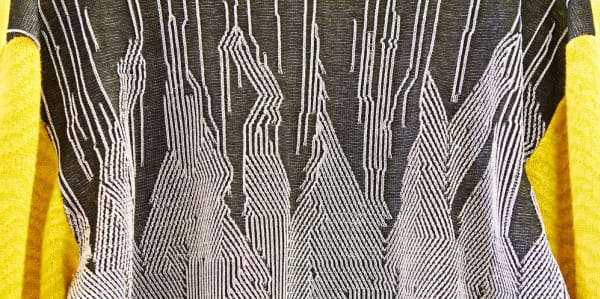 yellow and grey textile with geometric pattern