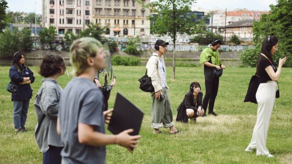 Students standing in a park at the Prague Quadrennial.