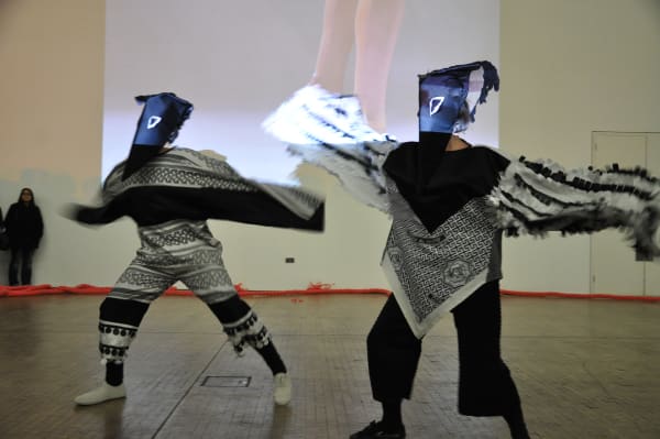 performers with masks