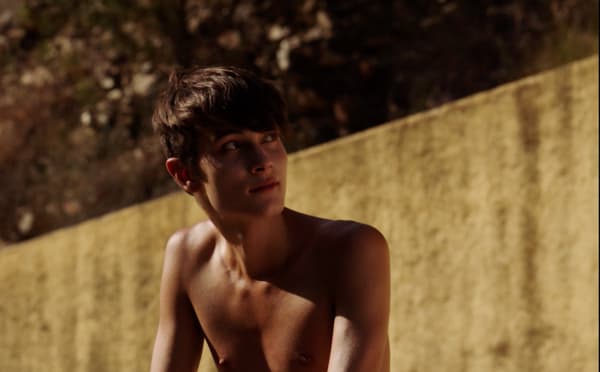 Still from student film showing young boy in the sun.