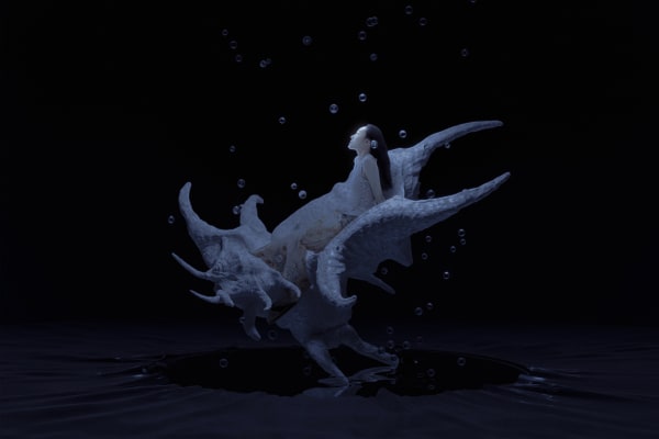 Asian model under water in a shell.
