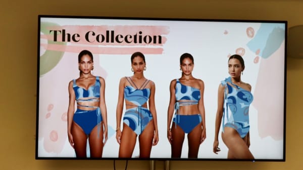 Screen showing three models in swimwear.
