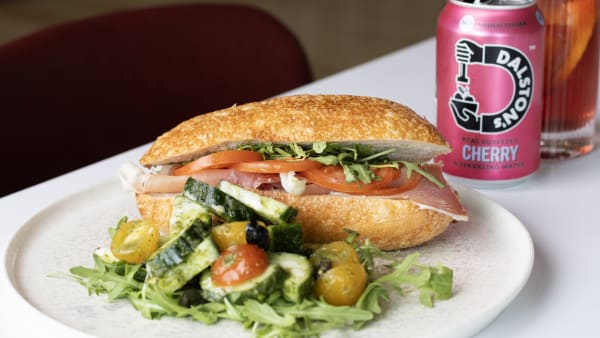 Sandwich on a plate with salad