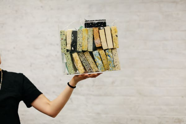 Hand holding material samples