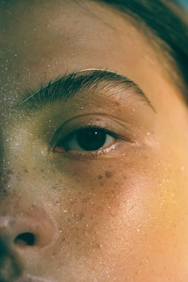 Close up of the left side of a woman's face showing an accessory on her eyebrow. MA Fashion, Film and Digital Production, work by Valerie Hsieh