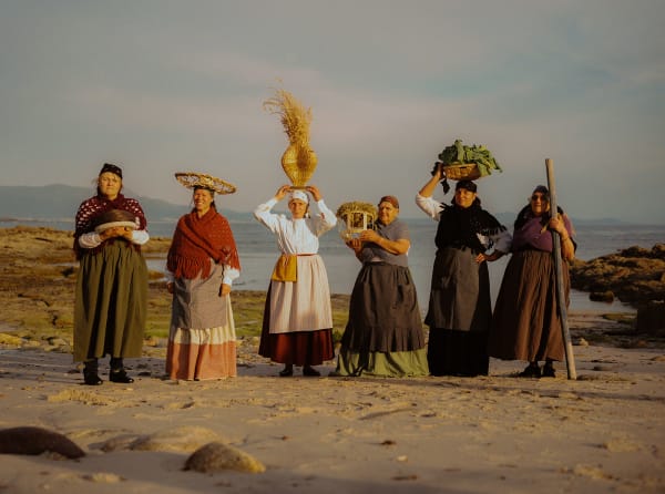 Portrait of five women holding baskets on the heads