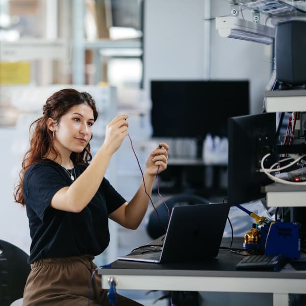 Rocio Rey holding up some wires