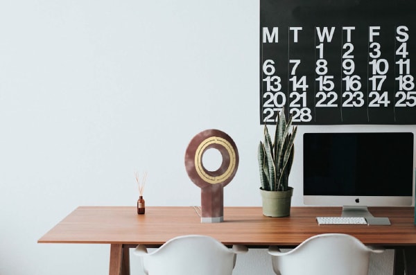 White text reading “Oom, Breathe, Focus, Mindful” over a cafe background