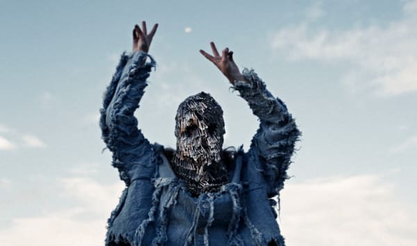 Female model in denim with face covered