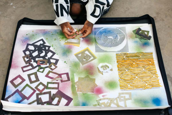 photo of a student working on colourful sketchbook