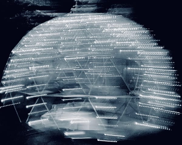 White lines in a dome shape on a black background.