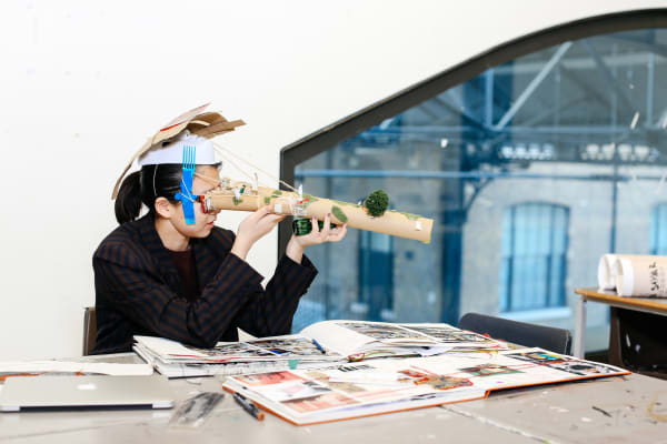 Student interacting with FAD work