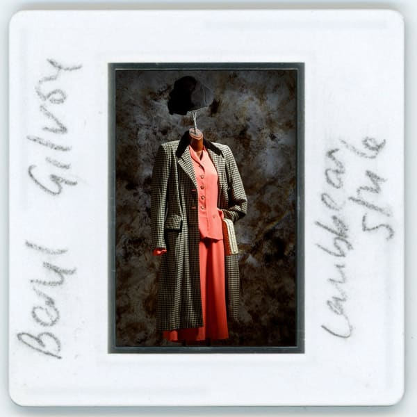 A-Polaroid-picture-of-a-red-suit-on-display.jpg
