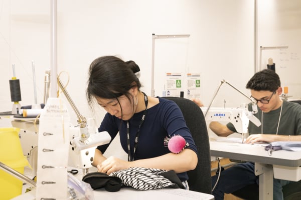 Students working at sewing machines 