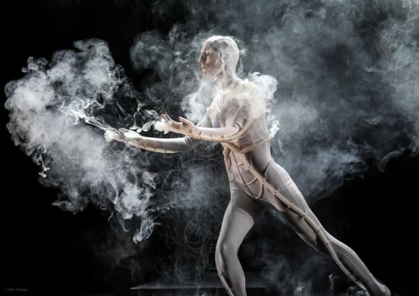 performer surrounded by a cloud of smoke 