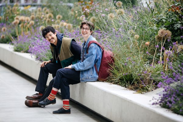 Two students in the summer garden at Camberwell