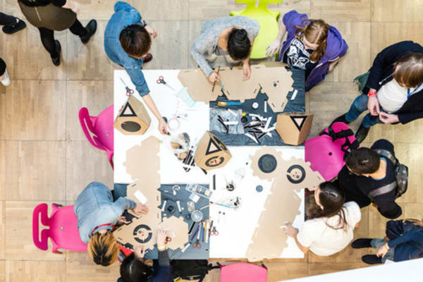 photo of students and staff collaborating