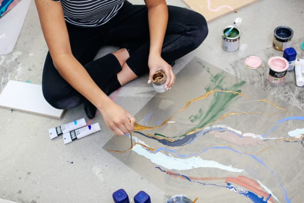 Nikitah Patel painting in the Studio. Photo Alys Tomlinson.
