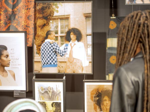 Student looking at exhibition.