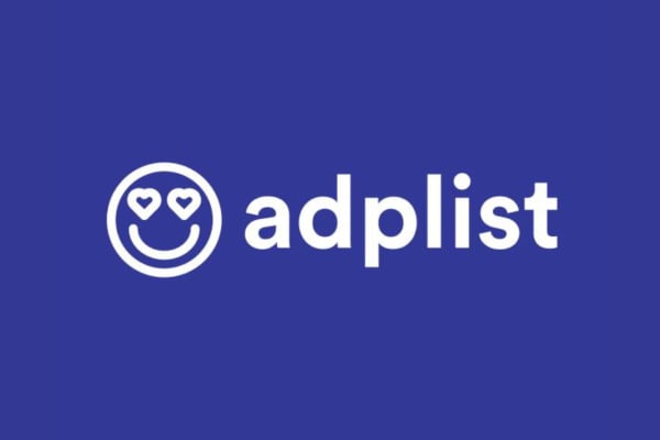 White on a dark blue background. On the left there is smiley face with hearts for eyes followed by the text 