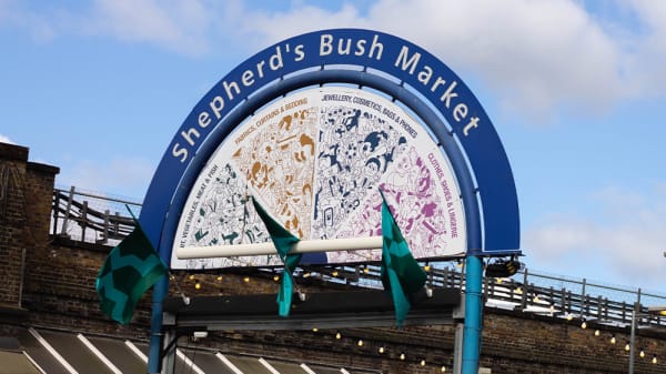 A sign for Shepherd's Bush Market