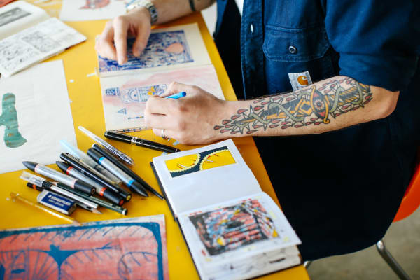 Student painting on a notebook 