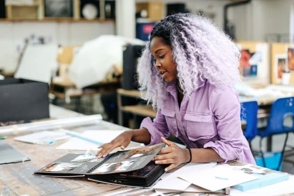 Tanikha (Renzo) Allen (BA Theatre Design, Wimbledon College of Art) showing her portfolio