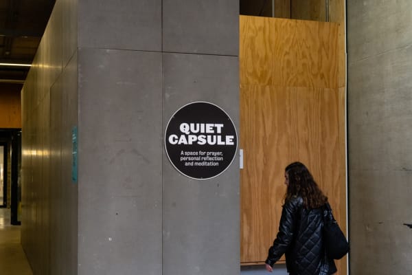 A student walking towards the Quiet Capsule at CSM.