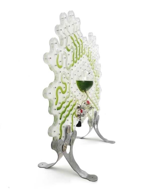 A shaped panel with green cells on legs