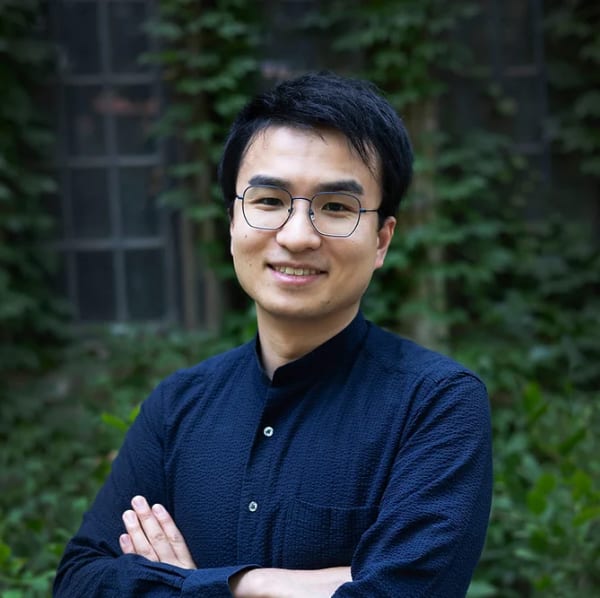 Prof. Ken Nakagaki standing in front of a blurred background.