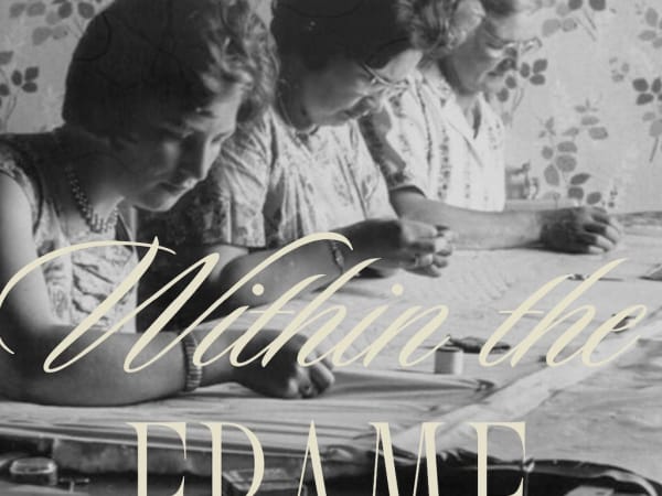 Black and white image of three older women working on fabric.