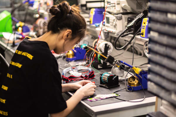 Student soldering in the Creative Technology Lab