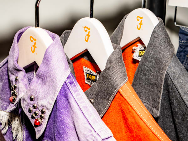 Vintage Farah jackets on hangers.