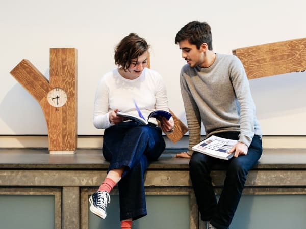 Students discussing their work
