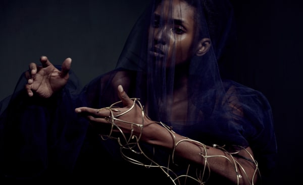 Female model with gold jewellery on her wrist