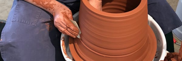 A man in the process of pottery