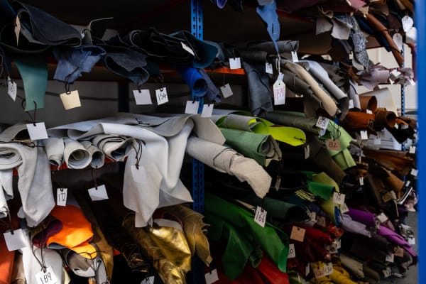 Rows of different fabrics, rolled up for storage