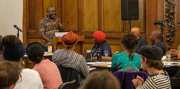 a speaker presenting infront of an audience