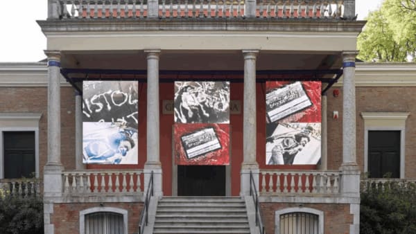 3 large-scale artworks draped over a museum building 