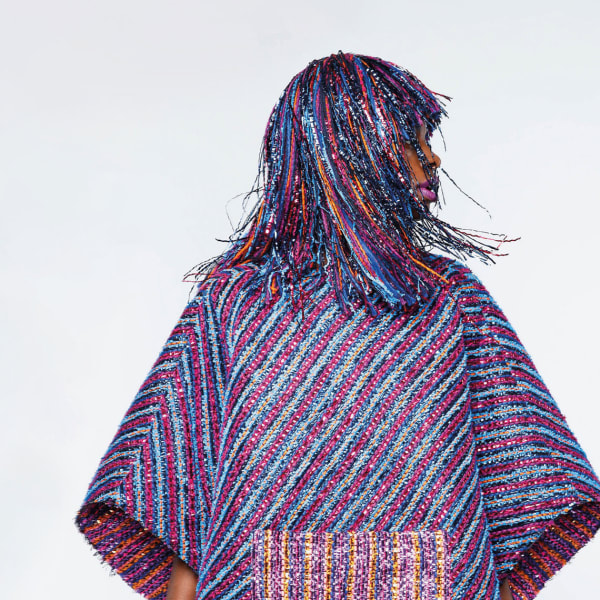 Model wearing a woven dress