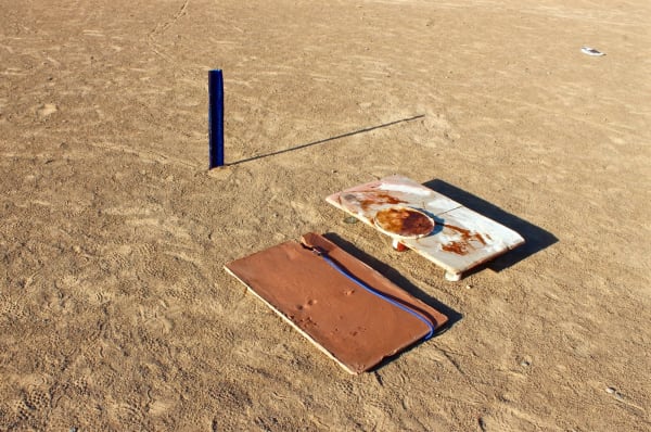 3 ceramic sculptural artworks in the sand outside by Meryl Yana - BA Fine Art.